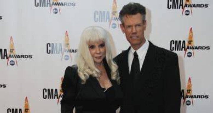 tabloid baby Randy Travis divorces his old lady